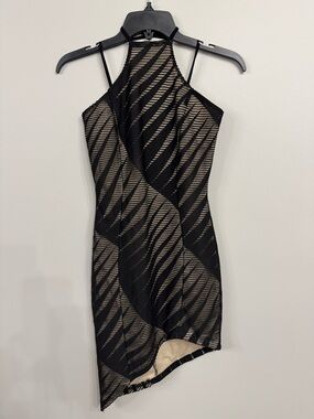 Women’s Alt.B bodycon black nude halter mini dress featuring an asymmetrical hem